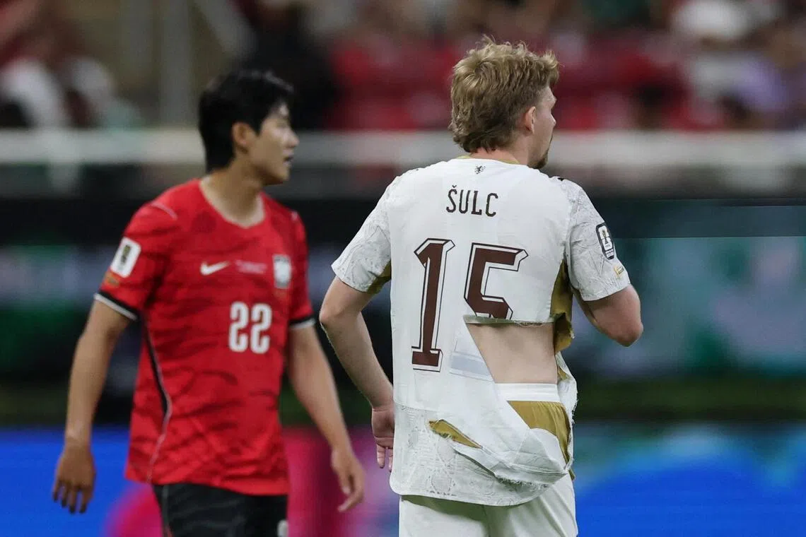 Czech Republic midfielder Pavel Sulc’s jersey was torn after he was pulled back by South Korean defender Lee Han-beom.