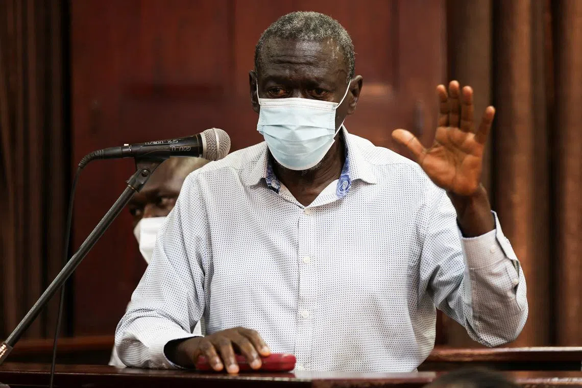FILE PHOTO: Uganda's four-time presidential candidate Kizza Besigye wears a facemark standing in the dock as he is charged with treason alongside his colleague Obeid Lutale, at the High Court in Kampala, Uganda July 13, 2026. REUTERS/Michael Muhati/File Photo