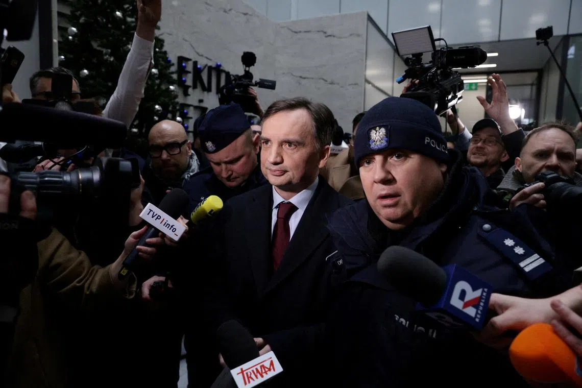 Former Polish justice minister Zbigniew Ziobro is surrounded by members of the media after he was detained by police at the Polish TV Republika station's headquarters on Jan 31. 2025.