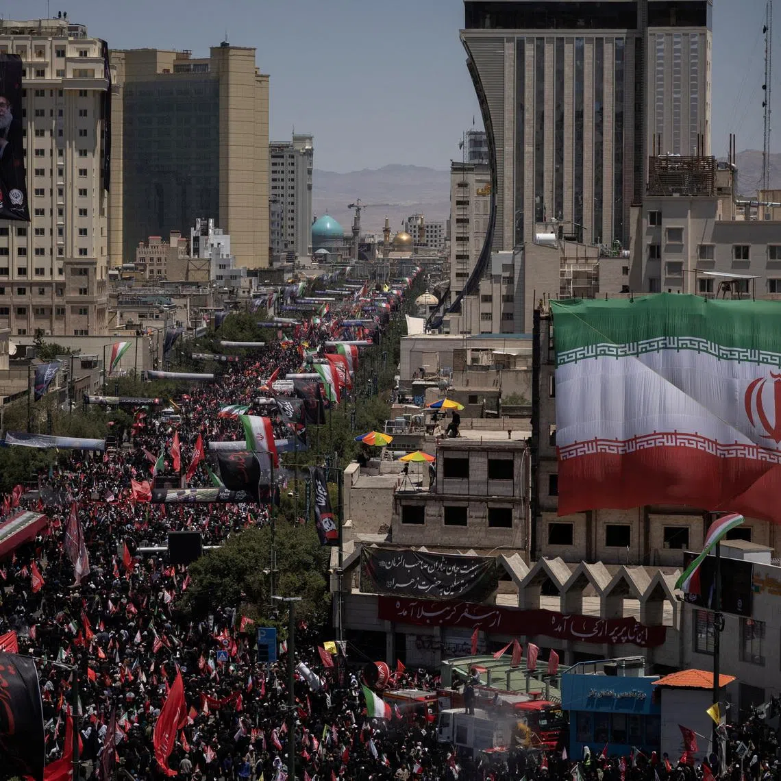 Mourners attend a funeral procession on the day of the burial of Iran’s late Supreme Leader Ayatollah Ali Khamenei in Mashhad, Iran, on July 9.