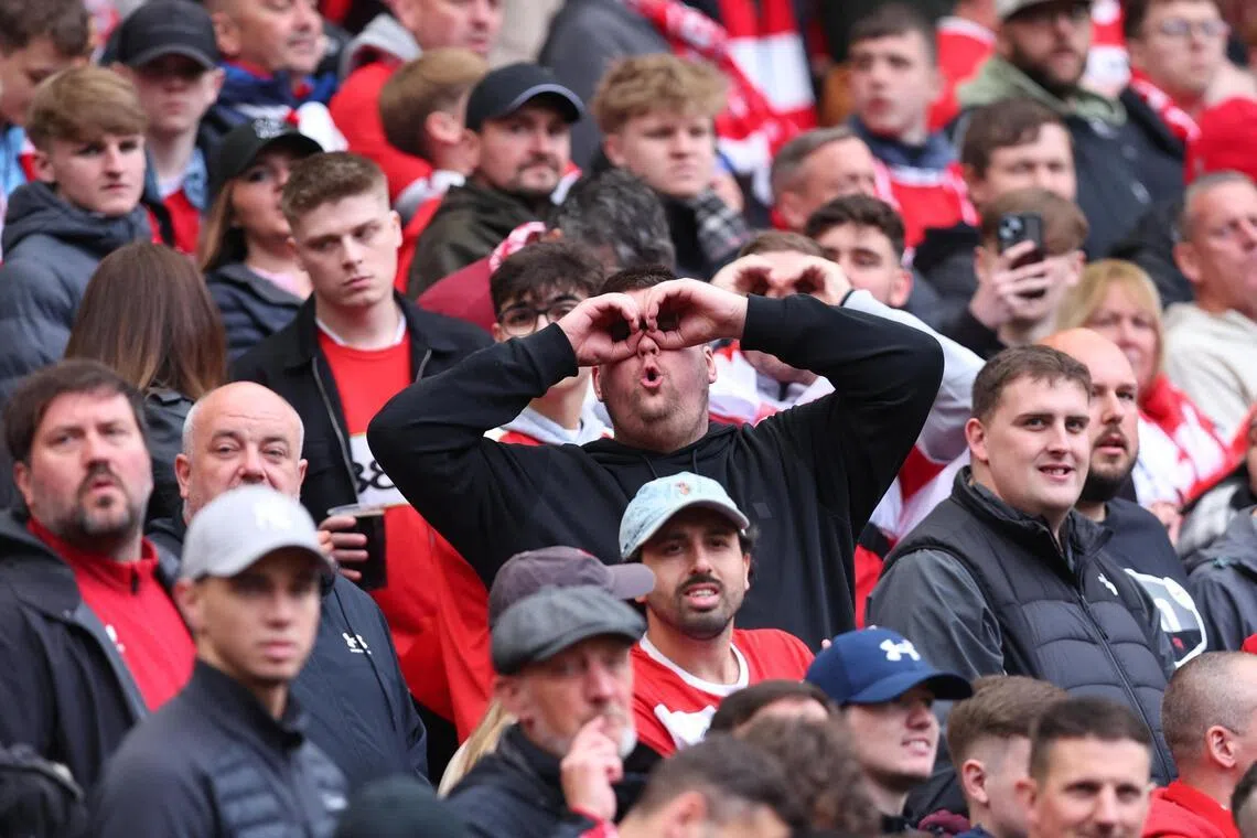 A Middlesbrough fan mocking Southampton fans for the "spygate" incident during the sides' 0-0 draw in the first leg of their Championship play-off semi-final on May 9. 