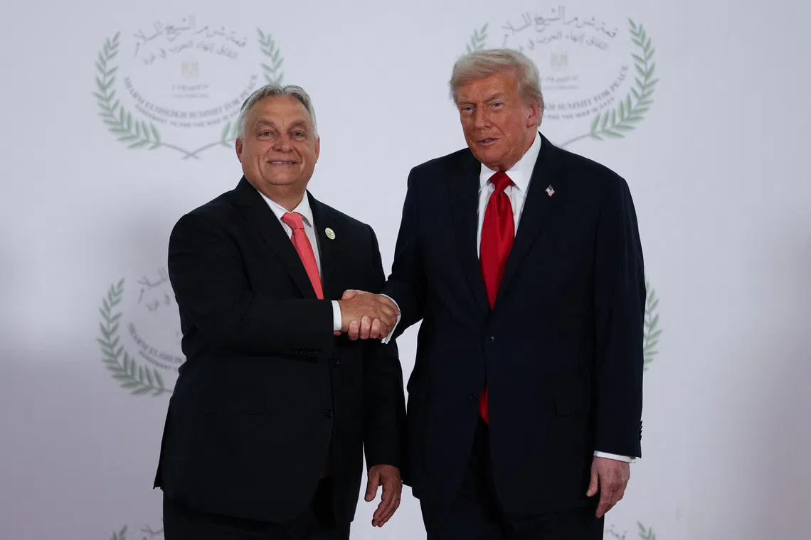 U.S. President Donald Trump and Hungarian Prime Minister Viktor Orban shake hands in Sharm el-Sheikh, Egypt, October 13, 2025. REUTERS/Suzanne Plunkett/Pool