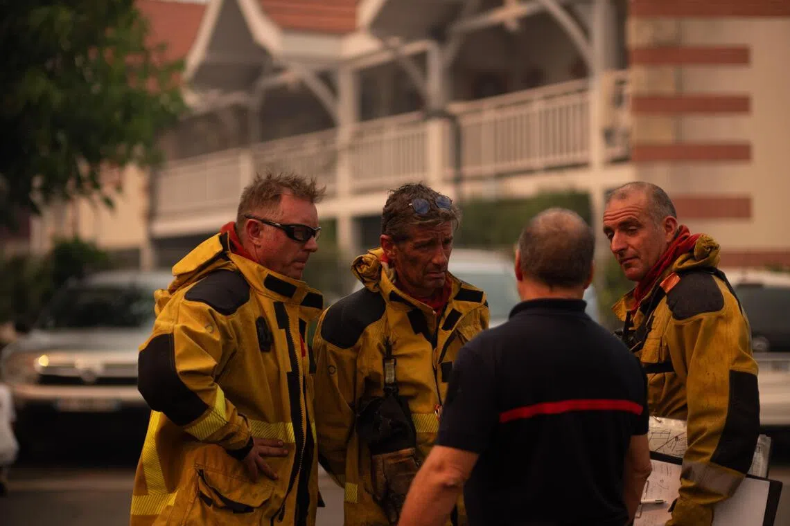 French firefighters helping with the evacuation of tourists and residents from the villages of France’s Cap-Ferret peninsula, in south-western France, on July 24.