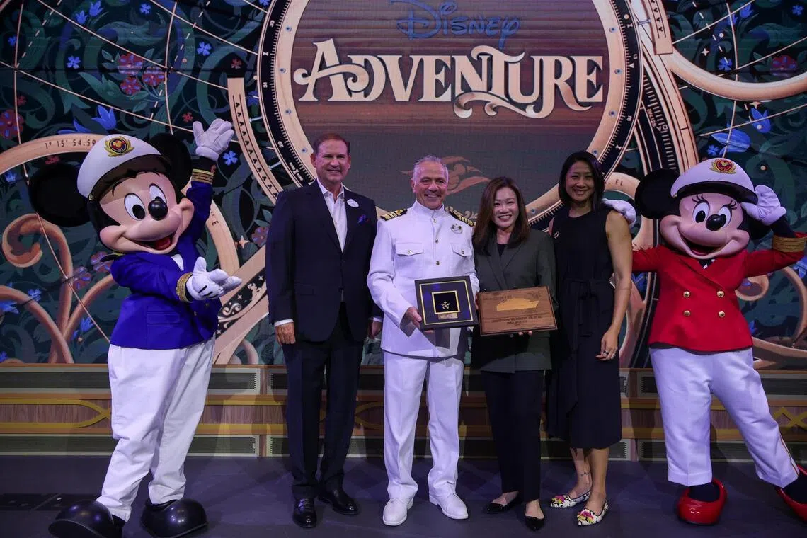 (From left) Disney Signature Experiences president Joe Schott, Captain Fabian Dib, Singapore Tourism Board chief executive Melissa Ow and Singapore Tourism Board assistant chief executive Jean Ng at a plaque exchange ceremony on the Disney Adventure on March 4.
