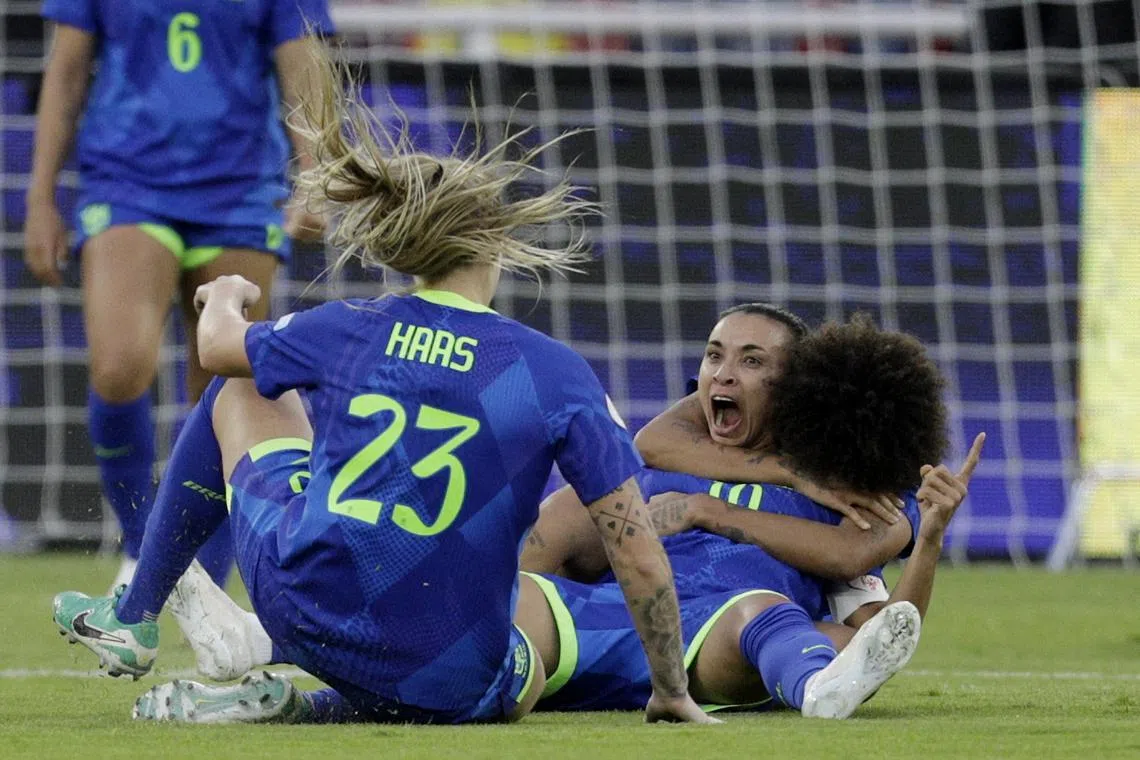 Soccer Football - Women's Copa America - Final - Colombia v Brazil - Estadio Rodrigo Paz Delgado, Quito, Ecuador - August 2, 2025 Brazil's Marta celebrates scoring their third goal with teammates REUTERS/Cristina Vega