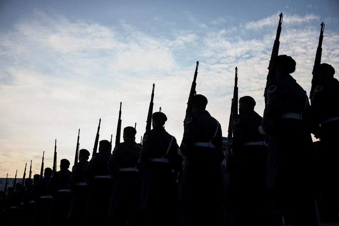 FILE PHOTO: Members of the military honour guard march, on the day of a meeting between German Defence Minister Boris Pistorius and European Commissioner for Defence and Space Andrius Kubilius in Berlin, Germany, February 10, 2025.  REUTERS/Liesa Johannssen/File Photo