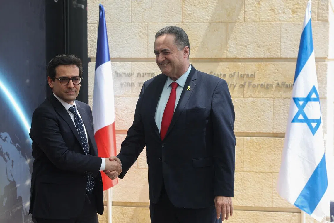French Foreign Minister Stephane Sejourne shakes hands with his Israeli counterpart Israel Katz, in Jerusalem, April 30, 2024. REUTERS/Ronen Zvulun