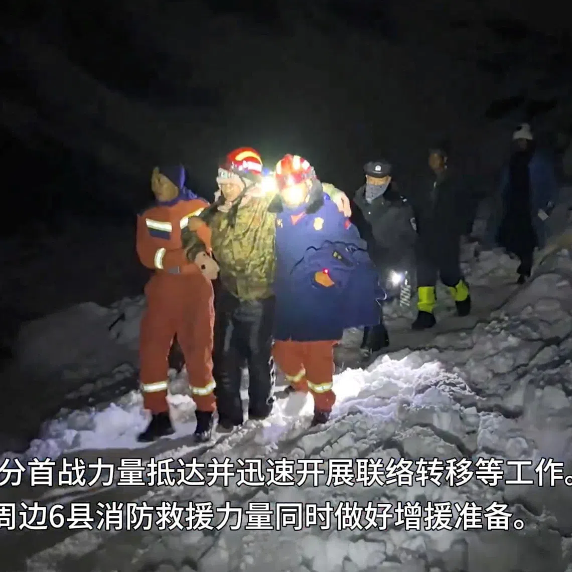 Tibetan firefighters rescue trekkers from Everest after they were stranded by a blizzard, in Tingri, Tibet Autonomous Region, China, in this screen grab taken from a video released on October 6, 2025.  Tibet Firefighting Department/Handout via REUTERS