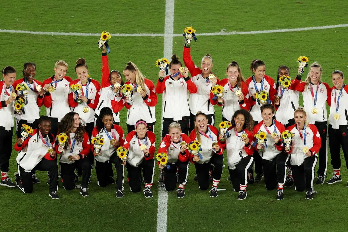 Tokyo 2020 Olympics women's football gold medallists Canada posing during the medal ceremony. 