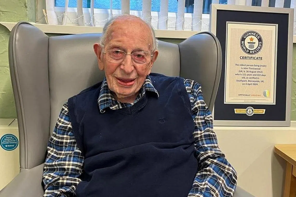 Mr John Tinniswood poses as Guinness World Records recognises him in April as the world's oldest living man.   He was 111 years old.
