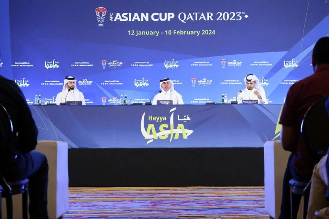 Hassan Rabea Al Kuwari, Executive Director of Marketing and Communications at the Local Organising Committee for the AFC Asian Cup Qatar 2023, and Abdulaziz Al-Mawlawi, Qatar Tourism Chief Marketing Officer, sit alongside the moderator at a press conference organised by the Local Organising Committee for the AFC Asian Cup Qatar 2023, in Doha, Qatar, October 9, 2023. REUTERS/Imad Creidi/File Photo