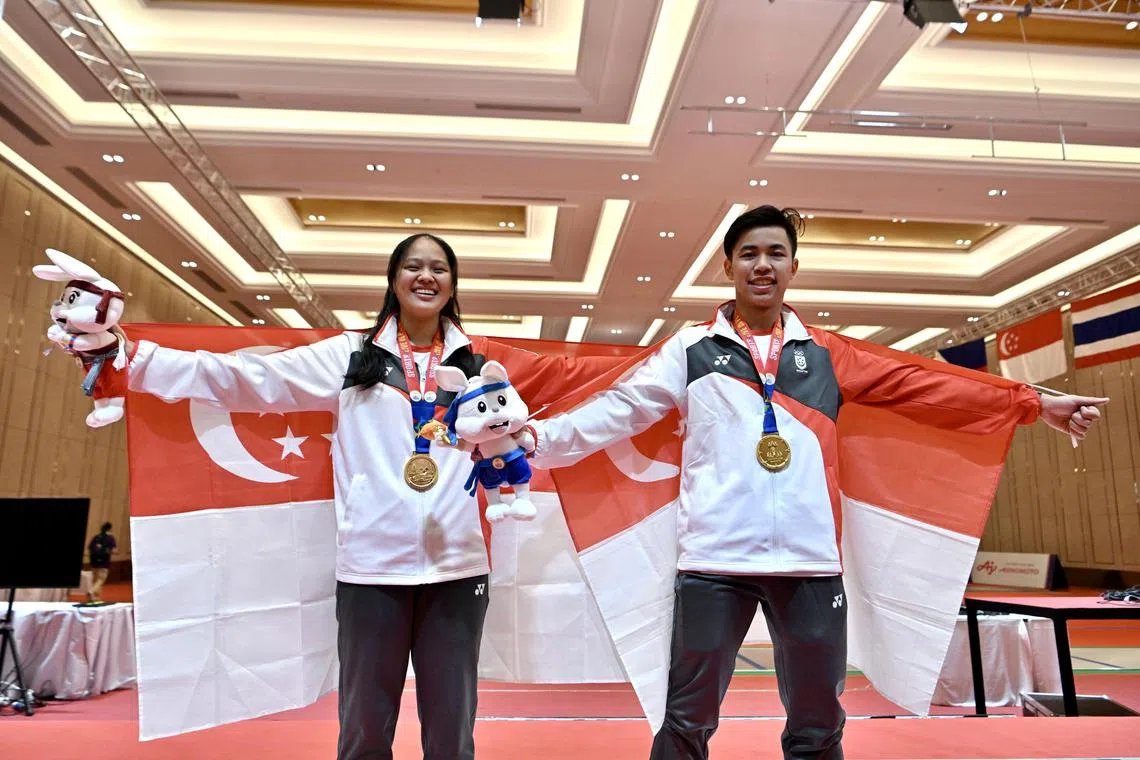 Singapore’s Elle Koh and Samuel Robson celebrating after winning the men's foil and women's epee titles on Saturday.