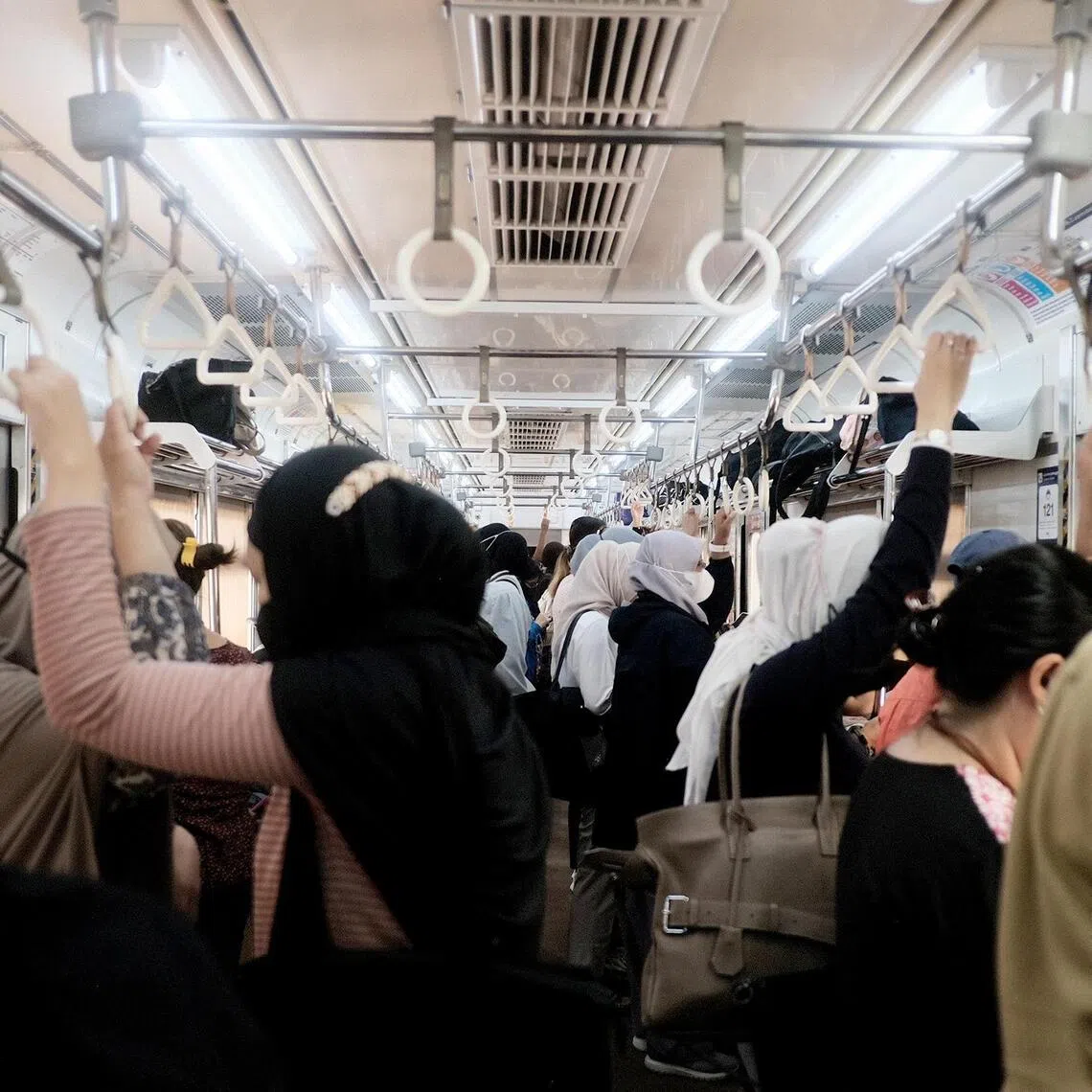 A full compartment in a commuter line train in Jakarta on Sept 7.