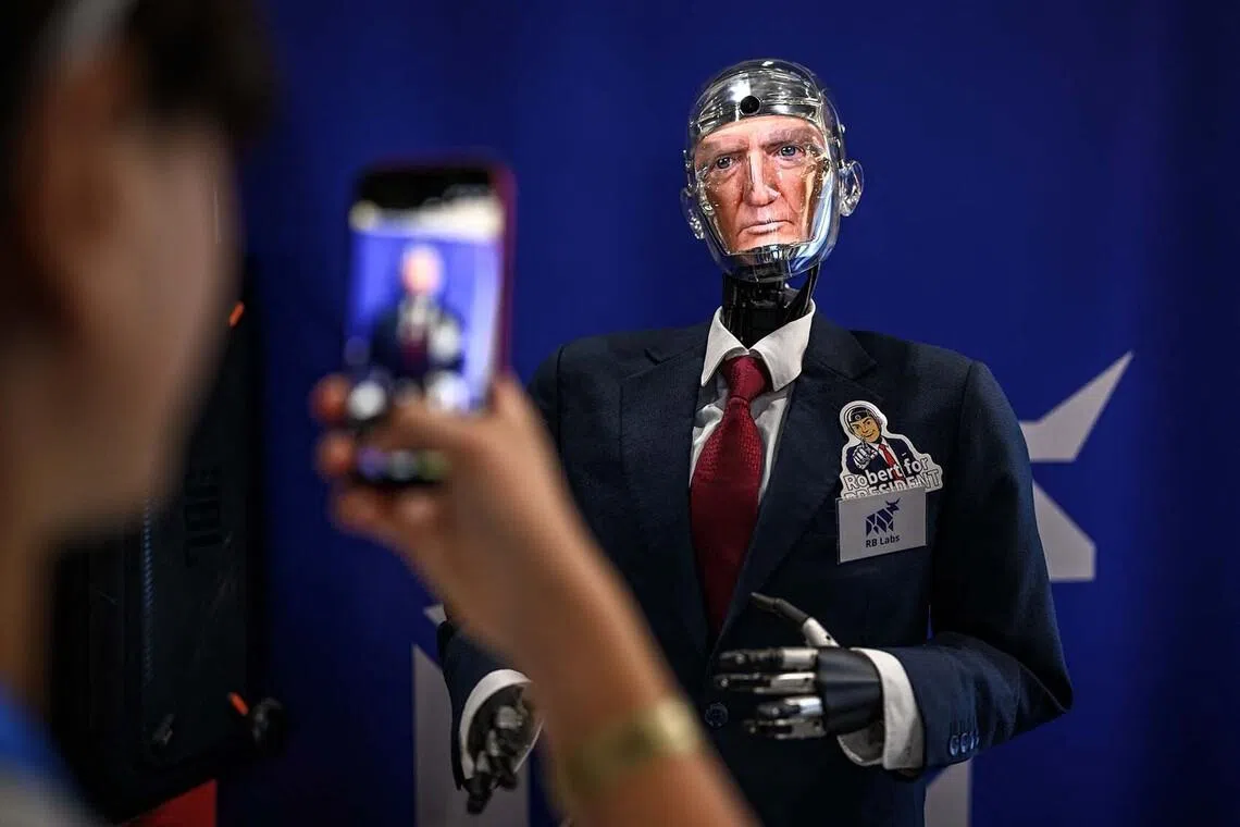 TOPSHOT - This photograph shows the face of US President Donald Trump displayed on Robert the Robot, an advanced conversational humanoid developed by Geneva-based technology company RB Labs, during the AI for Good Global Summit, a United Nations flagship event aimed at shaping the future of artificial intelligence, in Geneva on July 7, 2026. (Photo by Fabrice COFFRINI / AFP)