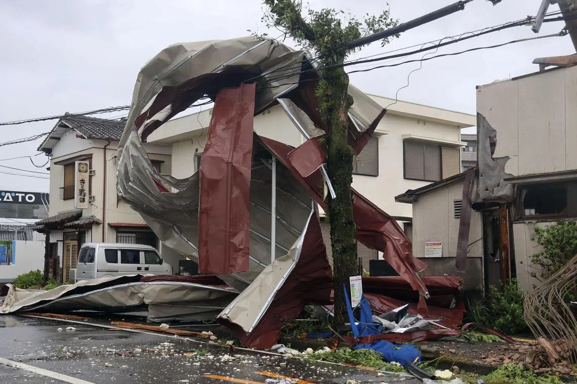 An object blown by strong winds caused by Typhoon Shanshan is stranded on a power line in Miyazaki, southwestern Japan, on Aug 29.