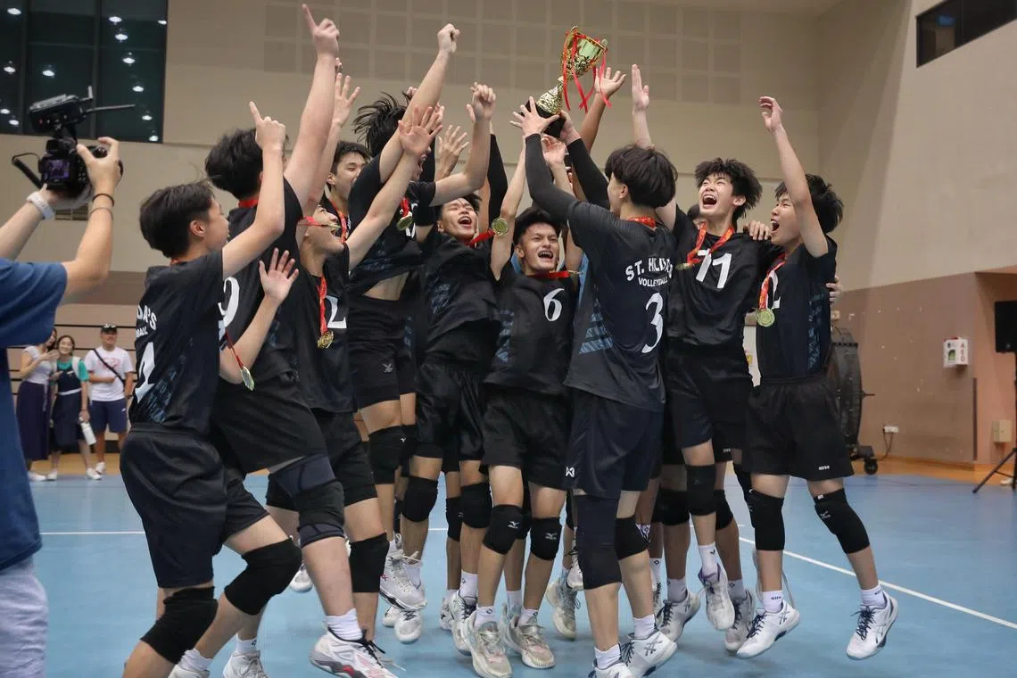 St. Hilda's Secondary School celebrating after winning the B Division Boys Volleyball final ST PHOTO: TARYN NG