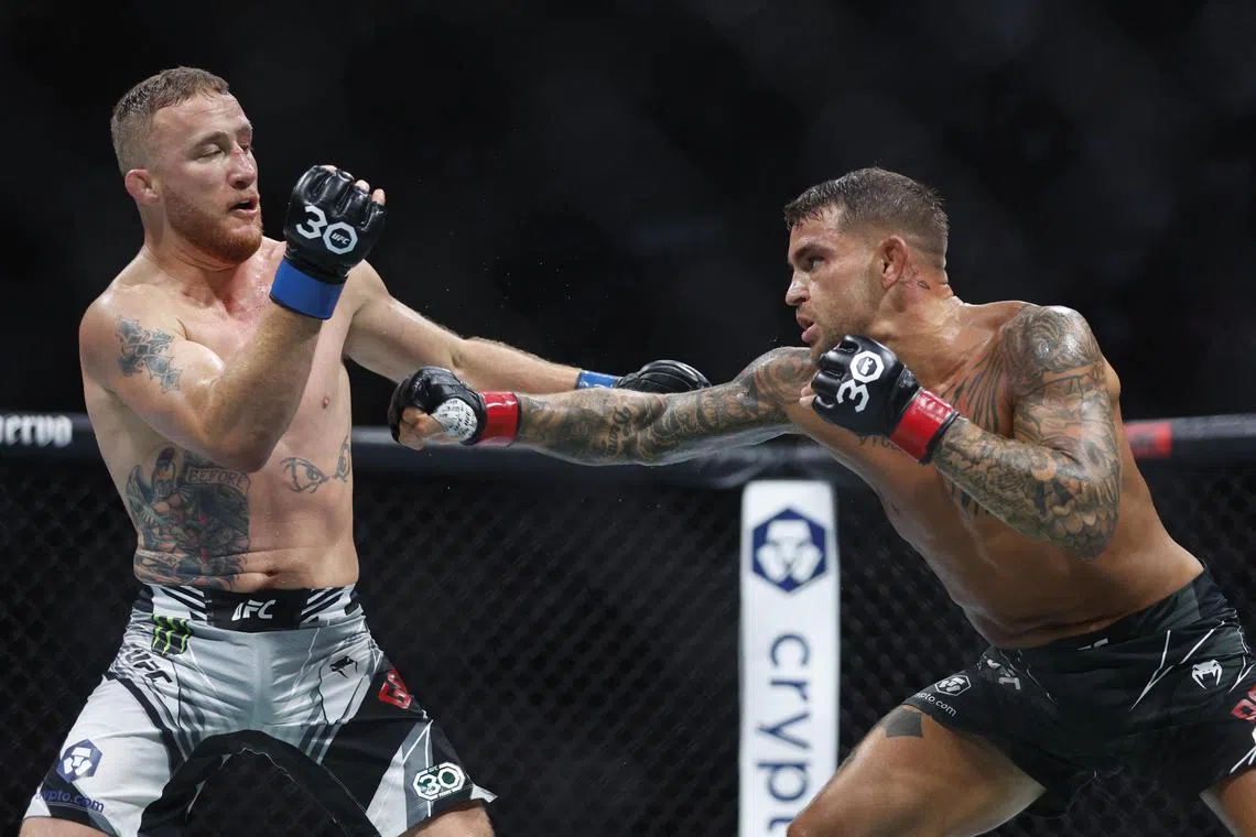 Jul 29, 2023; Salt Lake City, Utah, USA; Dustin Poirier (red gloves) fights Justin Gaethje (blue gloves) during UFC 291 at Delta Center. Mandatory Credit: Jeff Swinger-USA TODAY Sports