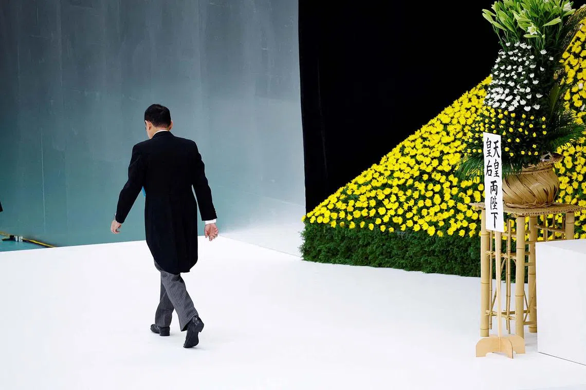 Japan's Prime Minister Fumio Kishida walking off stage after placing a flower, during a memorial service ceremony marking the 79th anniversary of Japan's surrender in World War Two, at Budokan Hall in Tokyo, Japan, Aug 15, 2024. 