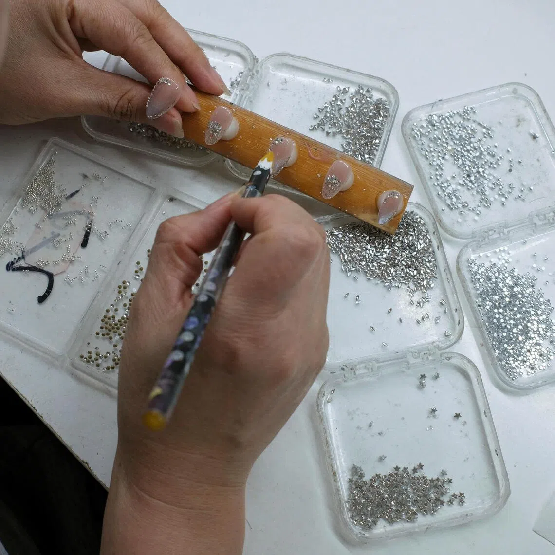 While there is no customs data for artificial nails, producers say business is booming.