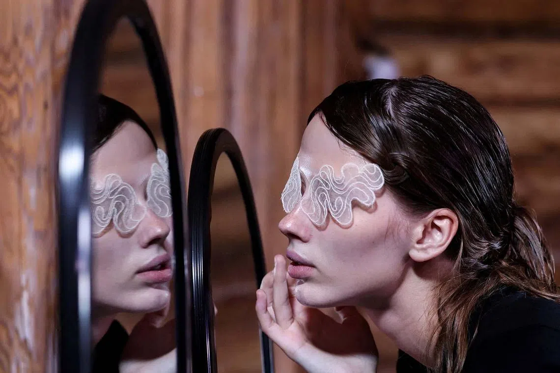 A model preparing backstage during the Moscow Fashion Week in Moscow, Russia Sept 1, 2025. 