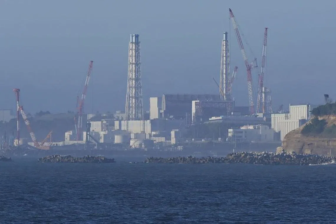The tsunami-crippled Fukushima Daiichi nuclear power plant is seen from Namie Town, Fukushima prefecture, Japan August 24, 2023, in this photo taken by Kyodo. Kyodo/via REUTERS