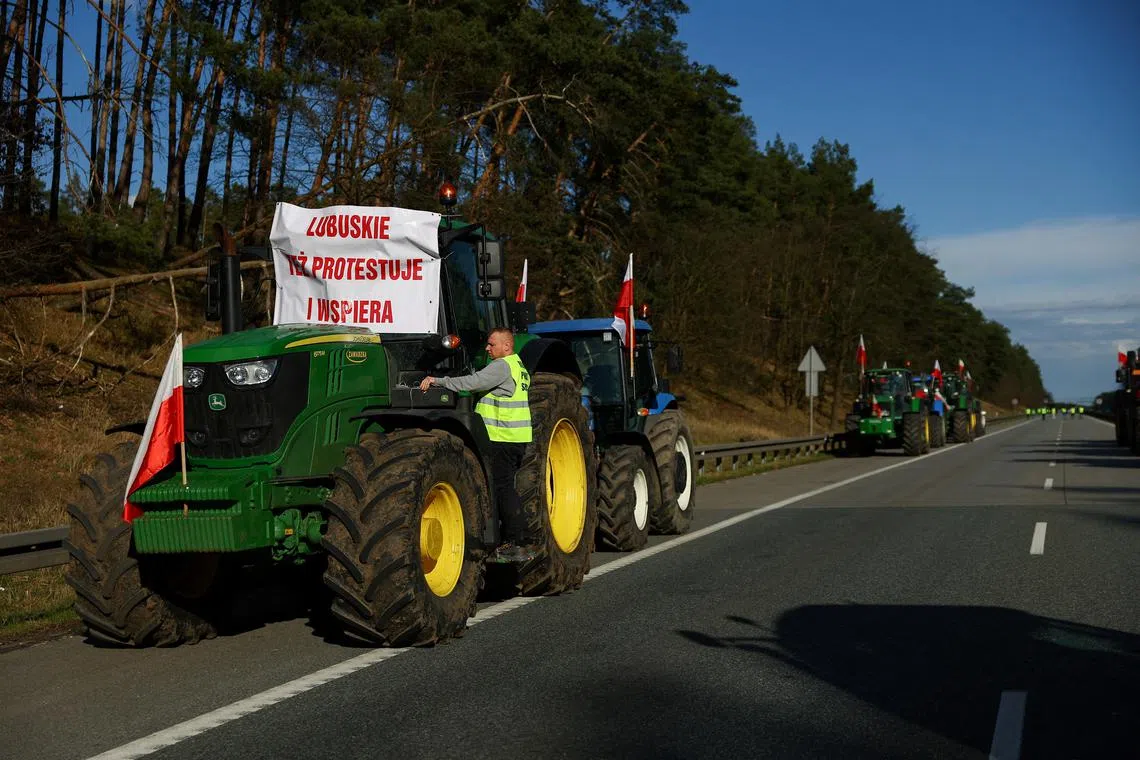 Polish farmers block the A2 motorway to protest over price pressures, taxes and green regulation, grievances shared by farmers across Europe, and against the import of agricultural produce and food products from Ukraine, close to the Polish-German border, near Swiecko, Poland February 25, 2024. The banner reads \"Lubuskie Voivodeship also protests and supports\". REUTERS/Lisi Niesner/File Photo