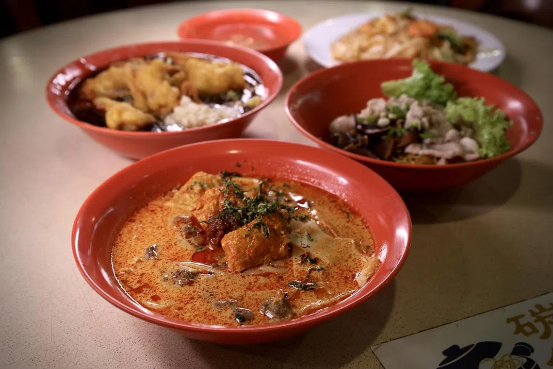 Clockwise from front: Laksa, Fried Fish Lor Mee, Penang Char Kway Teow and Mushroom Minced Meat Noodle Dry.