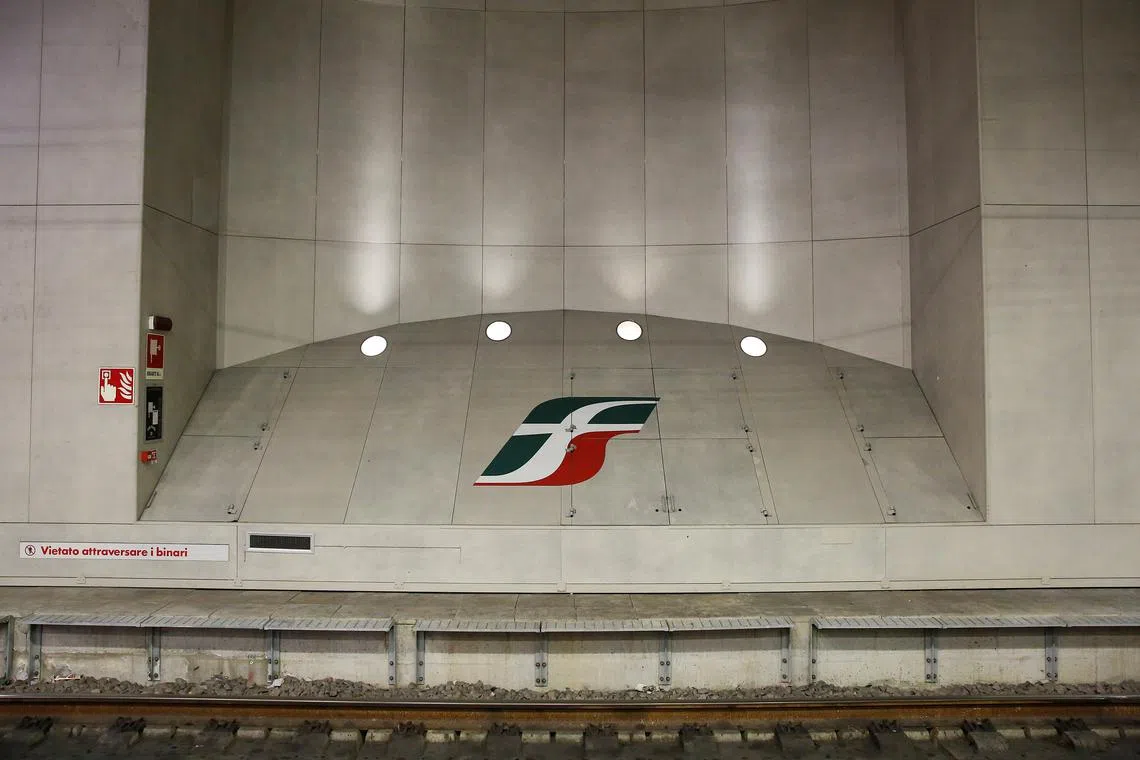 FILE PHOTO: An Italian railway group Ferrovie dello Stato (FS) logo is seen at the Bologna Central Station, in Bologna, Italy February 2, 2018.  REUTERS/Alessandro Bianchi/File Photo