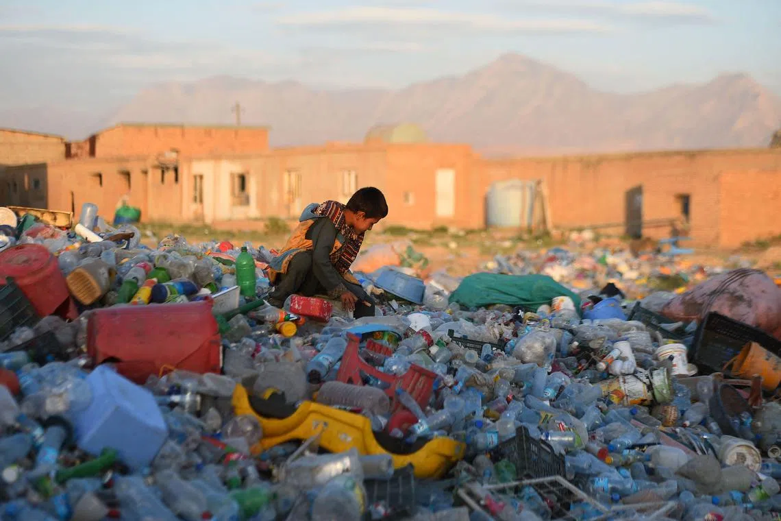 A child working in a plastics recycling factory on the outskirts of Mazar-i-Sharif, Afghanistan, in June 2019. A mountain of waste polymers is likely to be one of the most lasting monuments of the 21st century, says the writer.