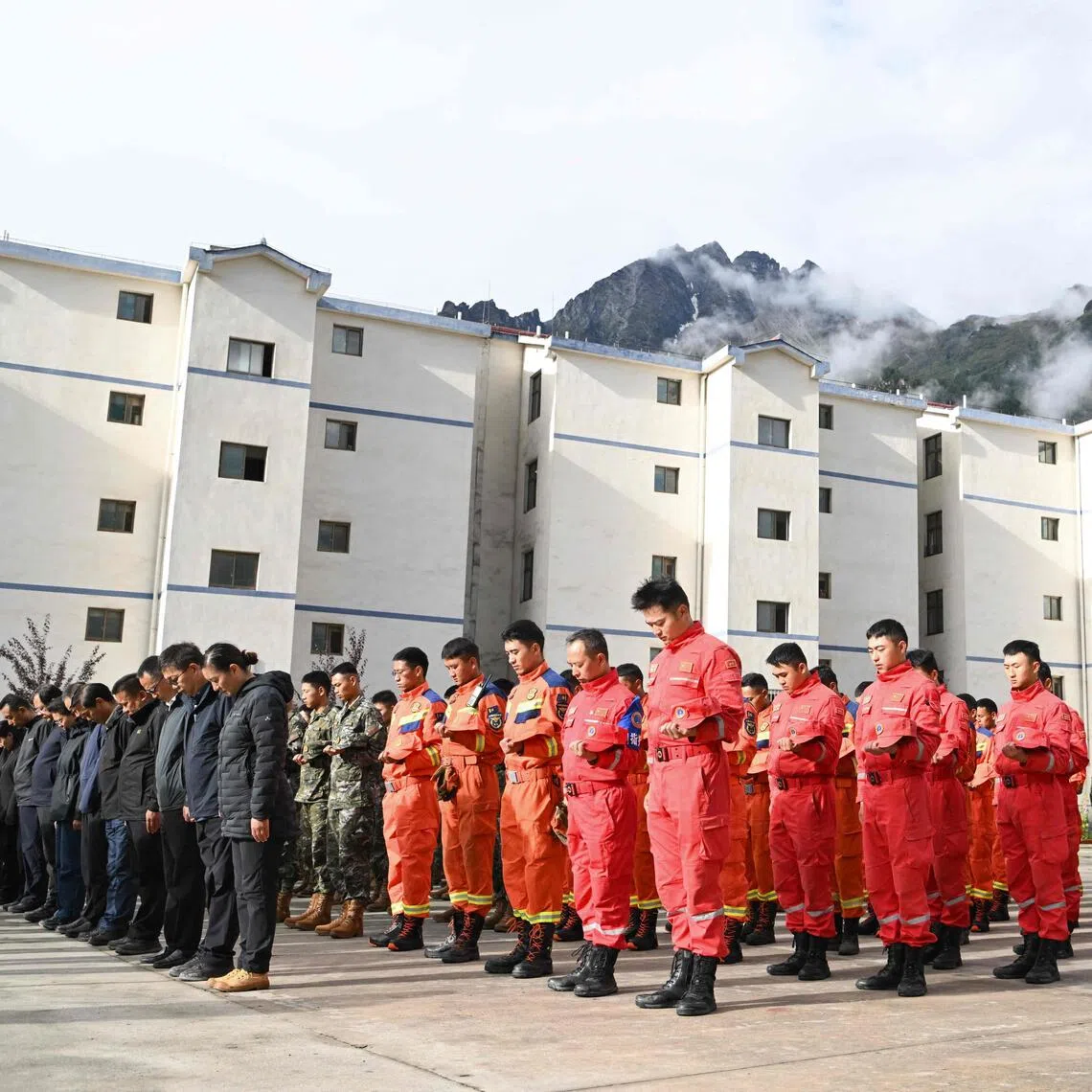 Mourners attend a memorial service for victims of a mudslide at the Gyirong Port police station in Gyirong County, in China’s western Tibet region on Sept 1.