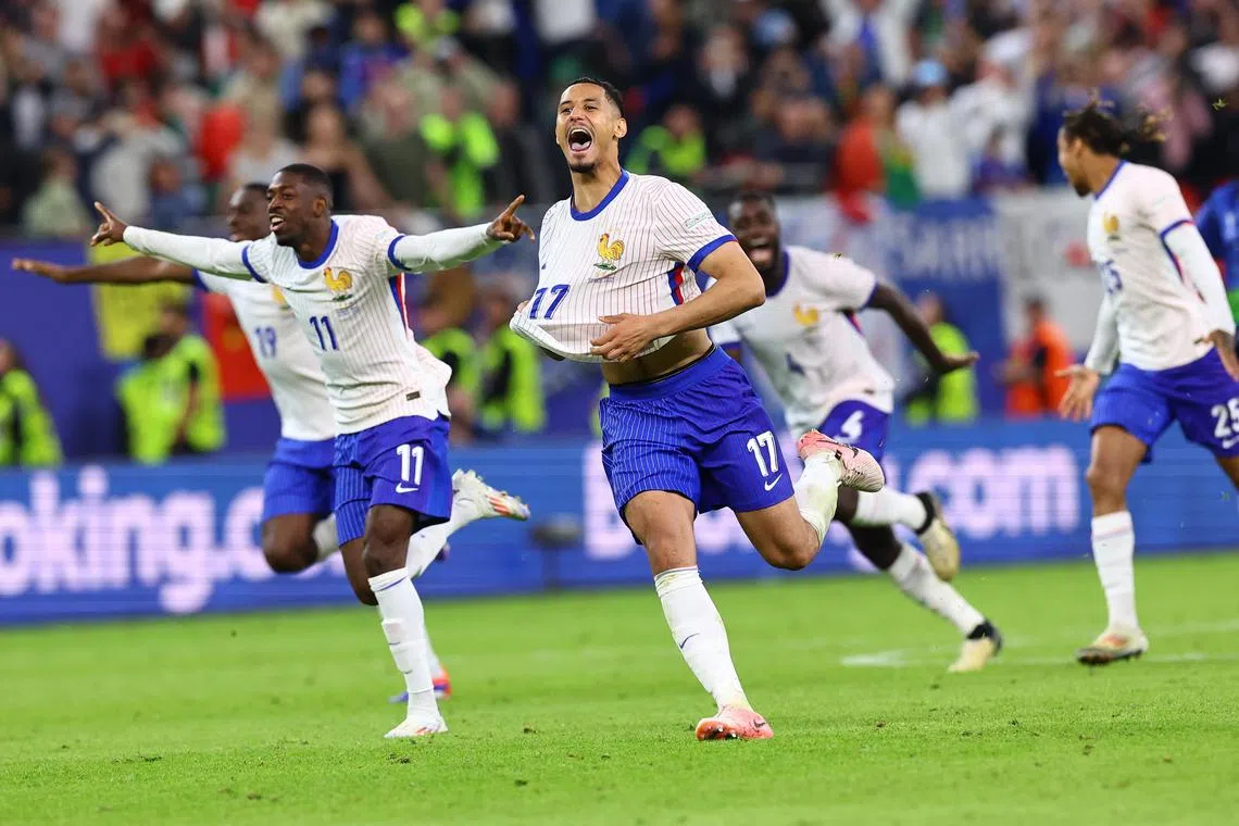 French players celebrate after winning the penalty shootout against Portugal.
