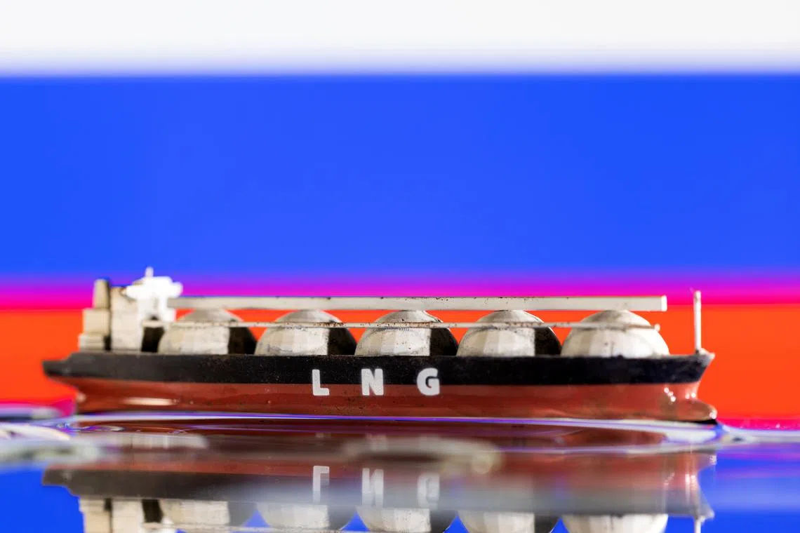 Model of LNG tanker is seen in front of Russia's flag in this illustration taken May 19, 2022. REUTERS/Dado Ruvic/Illustration