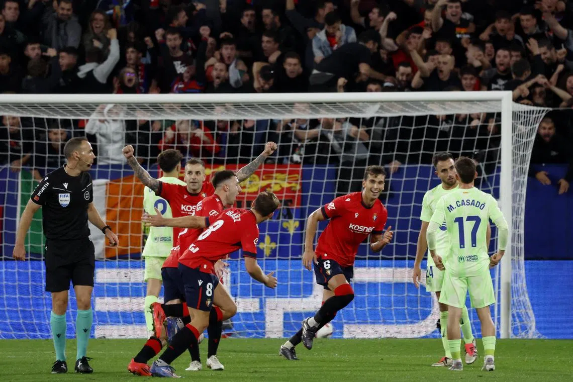 Osasuna celebrating Abel Bretones' goal in the 4-2 La Liga win over Barcelona at Estadio El Sadar on Sept 28.
