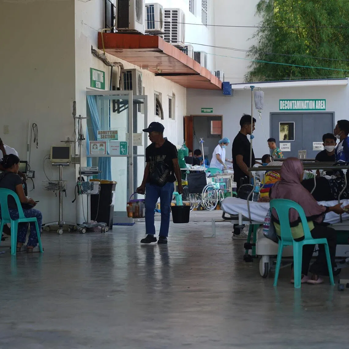 Patients are temporarily stationed outside the Sarangani Provincial Hospital in Alabel on June 9, 2026, after an influx of patients arrived following the 7.8 magnitude earthquake.