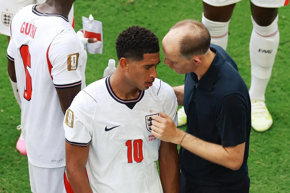 England manager Thomas Tuchel speaking to midfielder Jude Bellingham during a hydration break in their July 11 World Cup quarter-final match against Norway.