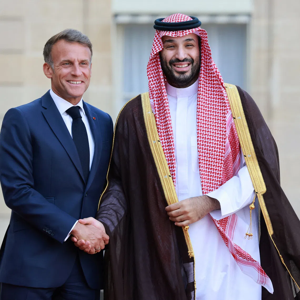 French President Emmanuel Macron (left) with Saudi Crown Prince Mohammed bin Salman as he arrives for a meeting at the Elysee Palace in Paris on Aug 24.