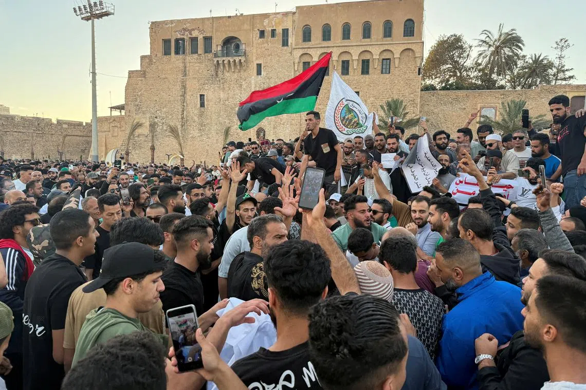 FILE PHOTO: Demonstrators demand the overthrow of the Libya's Government of National Unity headed by Abdulhamid al-Dbeibah, in Martyrs' Square in Tripoli, Libya. May 16, 2025.  REUTERS/Ayman al-Sahili/File Photo