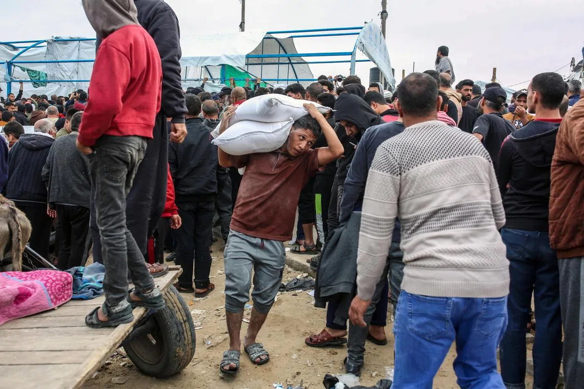 Flour is distributed by the United Nations Relief and Works Agency (UNRWA) at its headquarters in Khan Younis, southern Gaza Strip, in November 2023.
