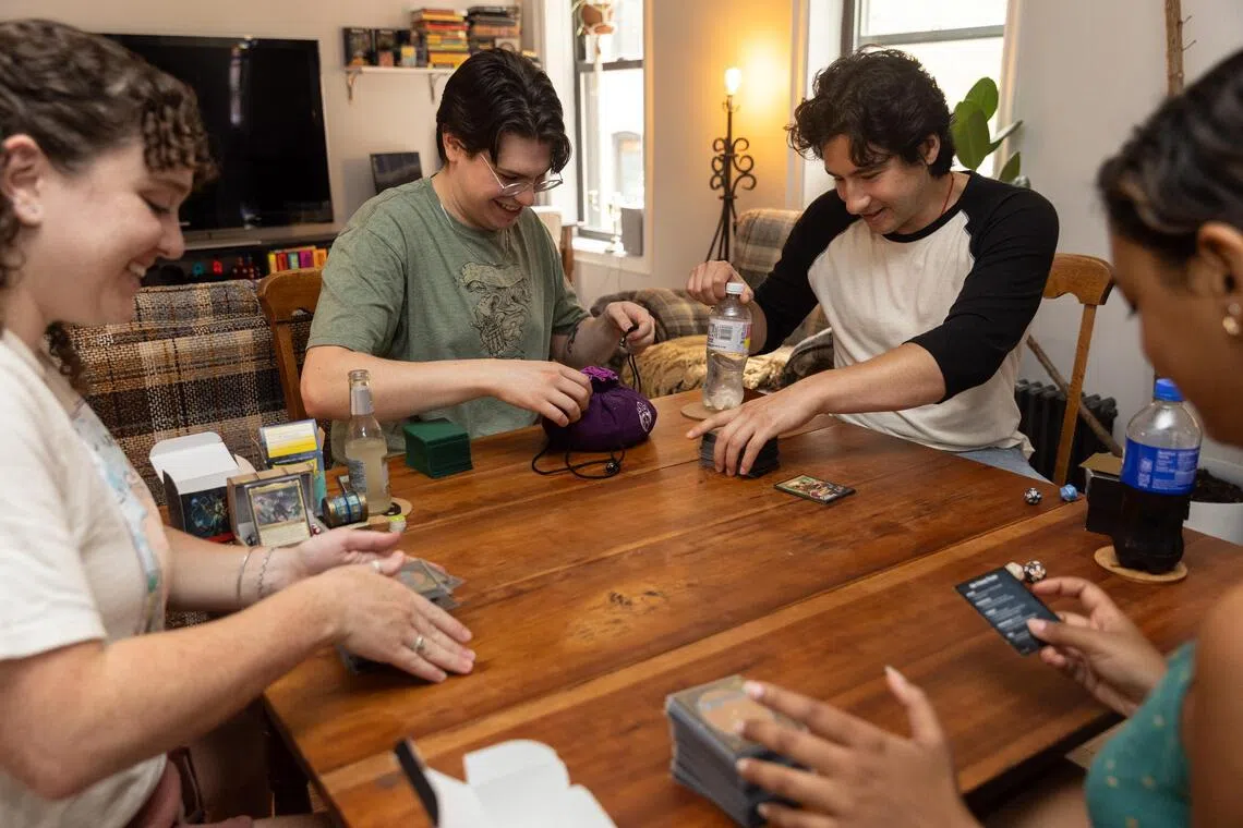 (Clockwise from left) Shea Dunlop and her boyfriend Nick Lamberti host their friends Leo Lerner and Yenilet Rodriguez to fun and games at their home.