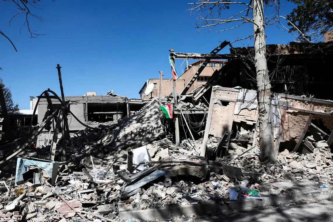 An Iranian flag lies amidst the rubble of a building of the Sharif University of Technology, which was damaged in a strike, amid the U.S.-Israeli conflict with Iran, in Tehran, Iran, April 7, 2026. Majid Asgaripour/WANA (West Asia News Agency) via REUTERS