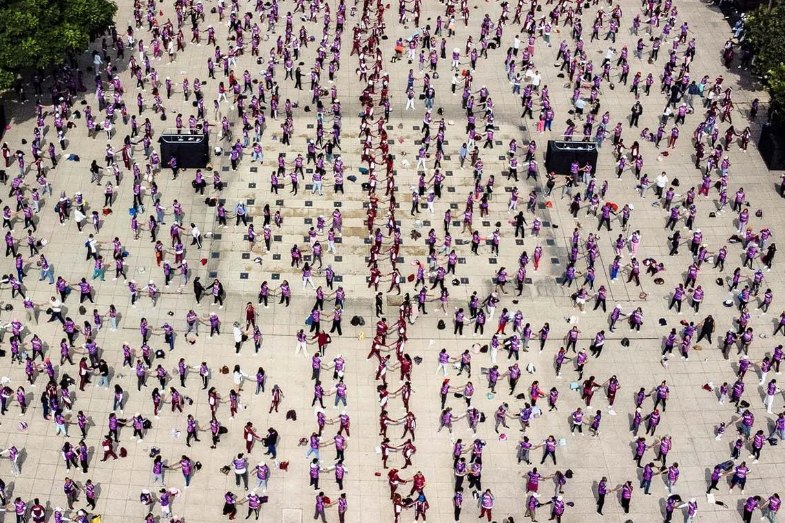 A mass self-defense class aimed at empowering participants and raising awareness on gender-based violence, at the Monumento a la Revolucion, in Mexico City, Mexico, Sept 7, 2025. 