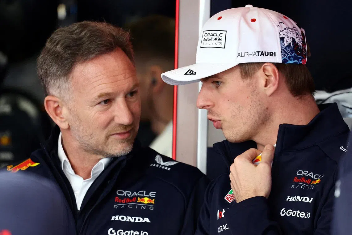 FILE PHOTO: Formula One F1 - Japanese Grand Prix - Suzuka Circuit, Suzuka, Japan - April 4, 2025 Red Bull's Max Verstappen with team principal Christian Horner ahead of the Japanese Grand Prix REUTERS/Issei Kato/File Photo