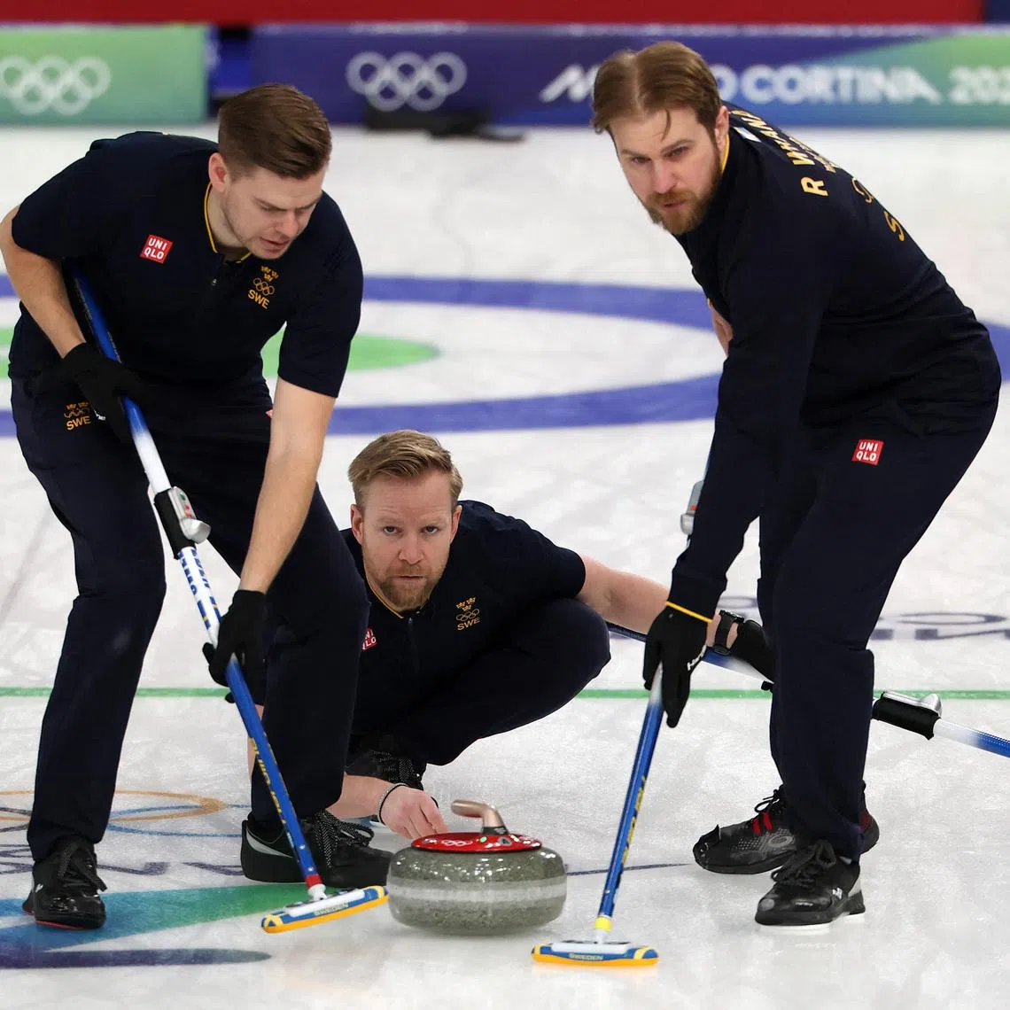 Milano Cortina 2026 Olympics - Curling - Men's Round Robin Session 12 - Sweden vs Czech Republic - Cortina Curling Olympic Stadium, Cortina d'Ampezzo, Italy - February 19, 2026. Niklas Edin of Sweden, Rasmus Wranaa of Sweden and Christoffer Sundgren of Sweden in action during the match against Czech Republic REUTERS/Issei Kato