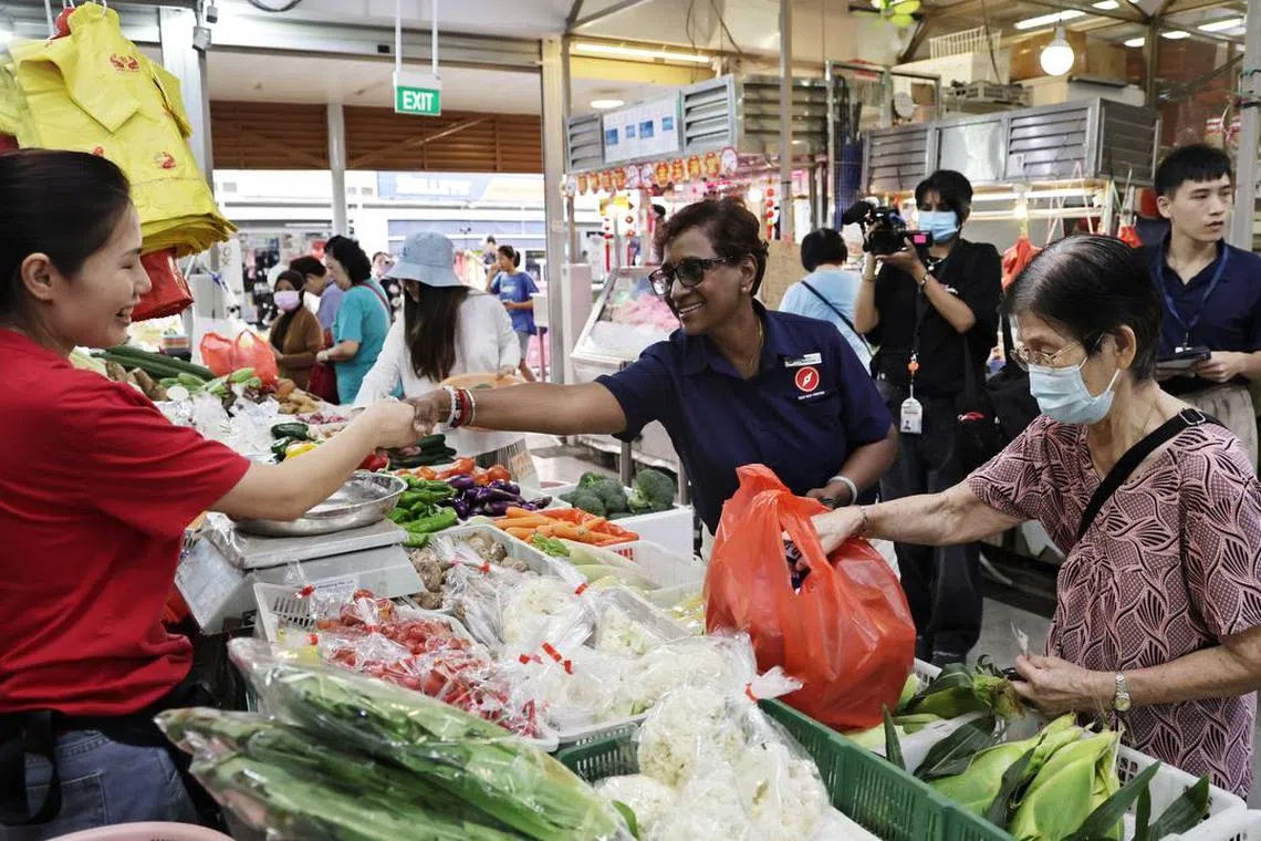 Red Dot United party candidate Kala Manickam for Jurong Central SMC during a walkabout at a wet market at Jurong Central Plaza on April 29.