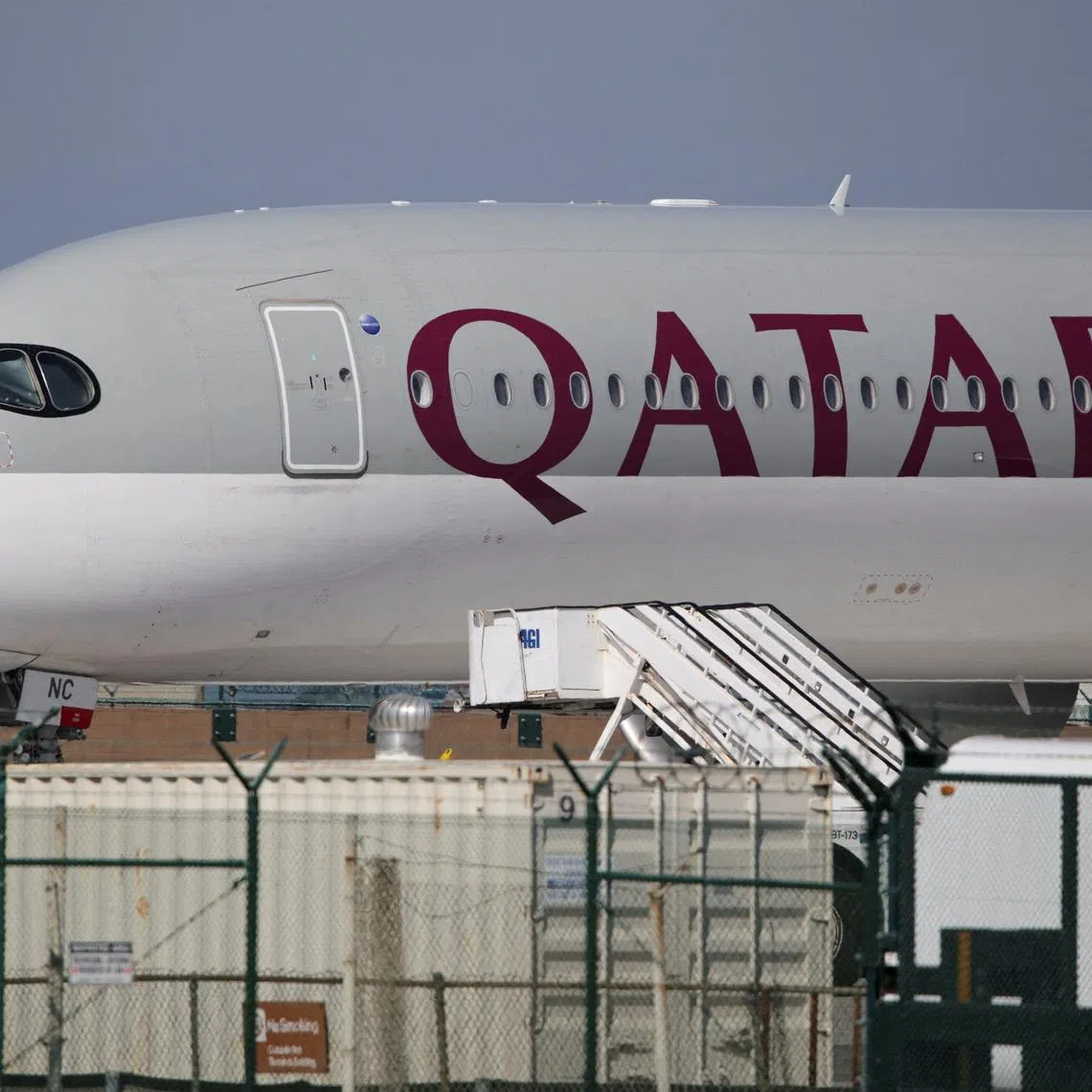 FILE PHOTO: A Qatar Airways plane sits on the tarmac at Los Angeles International Airport (LAX) in Los Angeles, California, U.S. March 3, 2026. REUTERS/Daniel Cole/File Photo