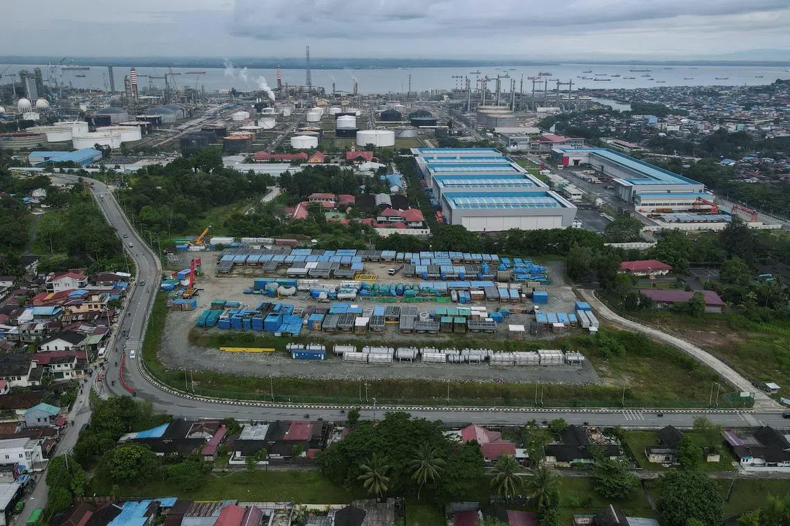 FILE PHOTO: General view of Balikpapan, one of the nearby cities of Indonesia's projected new capital called Nusantara, as state-owned Pertamina refinery seen in the background, in Balikpapan, East Kalimantan province, Indonesia, March 7, 2023. REUTERS/Willy Kurniawan/File Photo