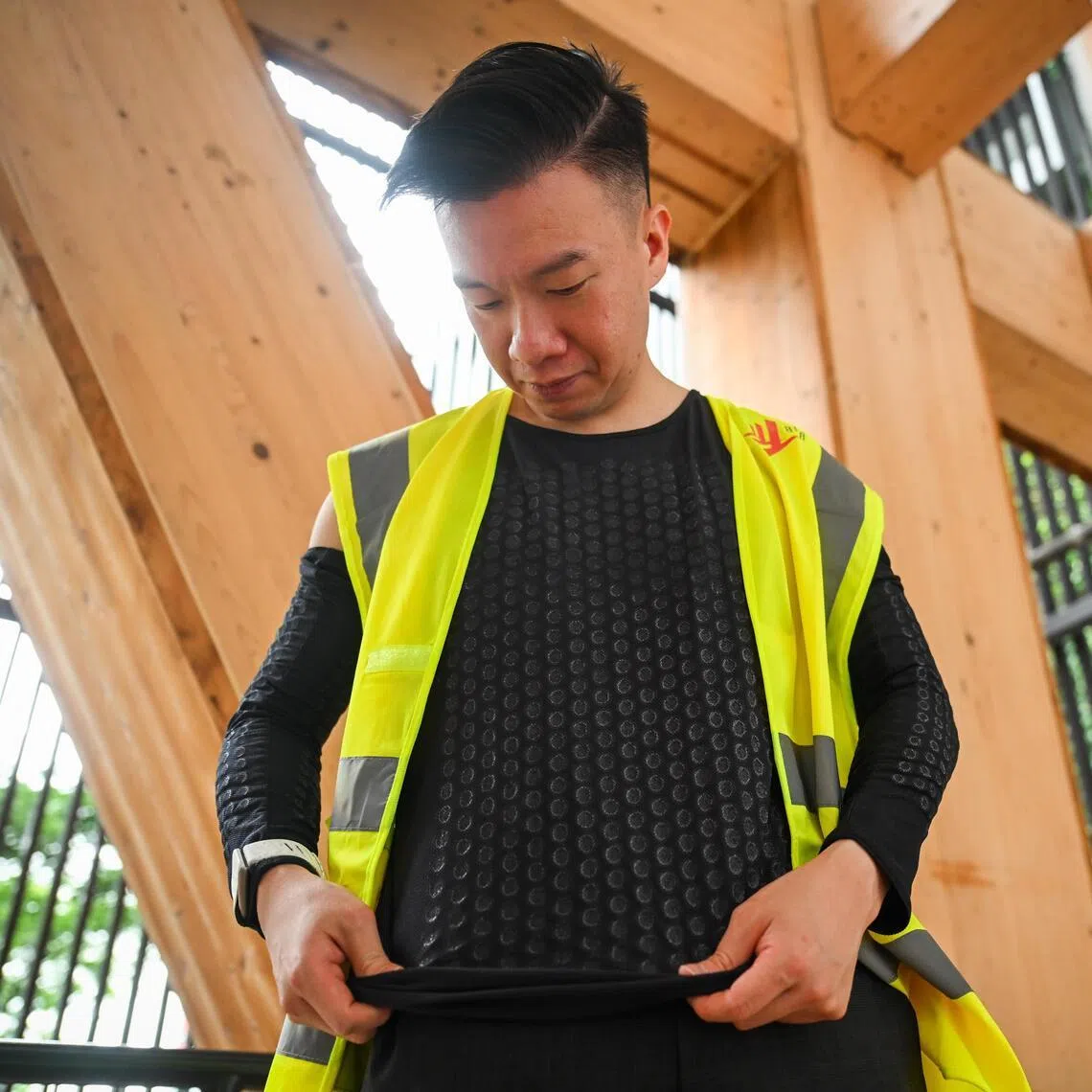 Mr Darryl Tan, Asia-Pacific's market lead for Eztia Materials, wearing the climate-tech firm's cooling singlet and arm sleeves.