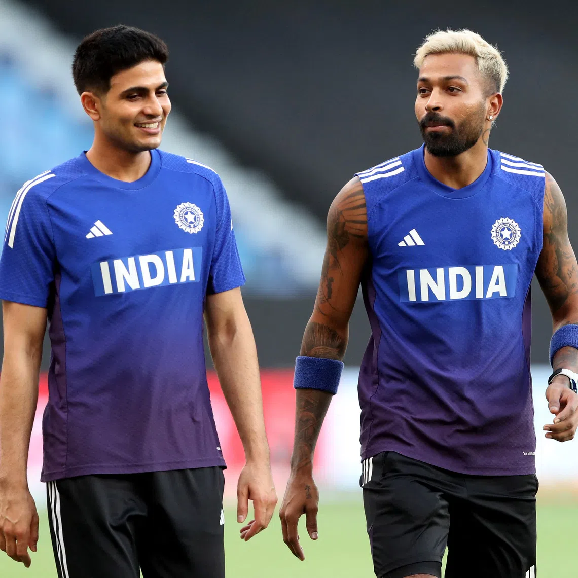FILE PHOTO: Cricket - Asia Cup - India v Bangladesh - Dubai International Cricket Stadium, Dubai, United Arab Emirates - September 24, 2025  India's Shubman Gill and India's Hardik Pandya during the warm up before the match REUTERS/Satish Kumar/ File Photo
