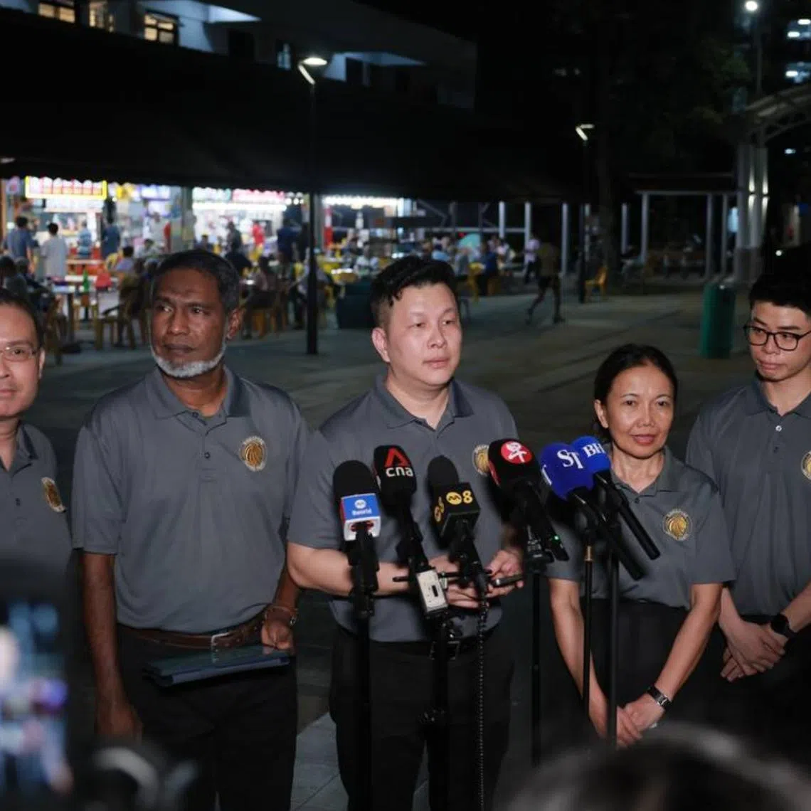 Singapore United Party secretary-general Andy Zhu (centre) with the party's Ang Mo Kio GRC candidates (from left) Vincent Ng, Ridhuan Chandran, Norani Yunus and Nigel Ng.