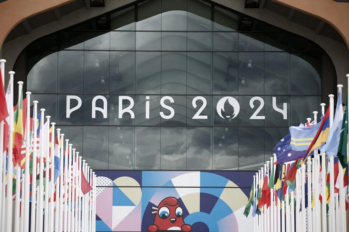 FILE PHOTO: Paris 2024 Olympics - Press visit at the Olympic and Paralympic athletes Village - Saint-Denis, France - July 16, 2024 The Paris 2024 Olympics logo is seen along with mascot Olympic Phryge on a building in the Olympic village REUTERS/Benoit Tessier/File Photo